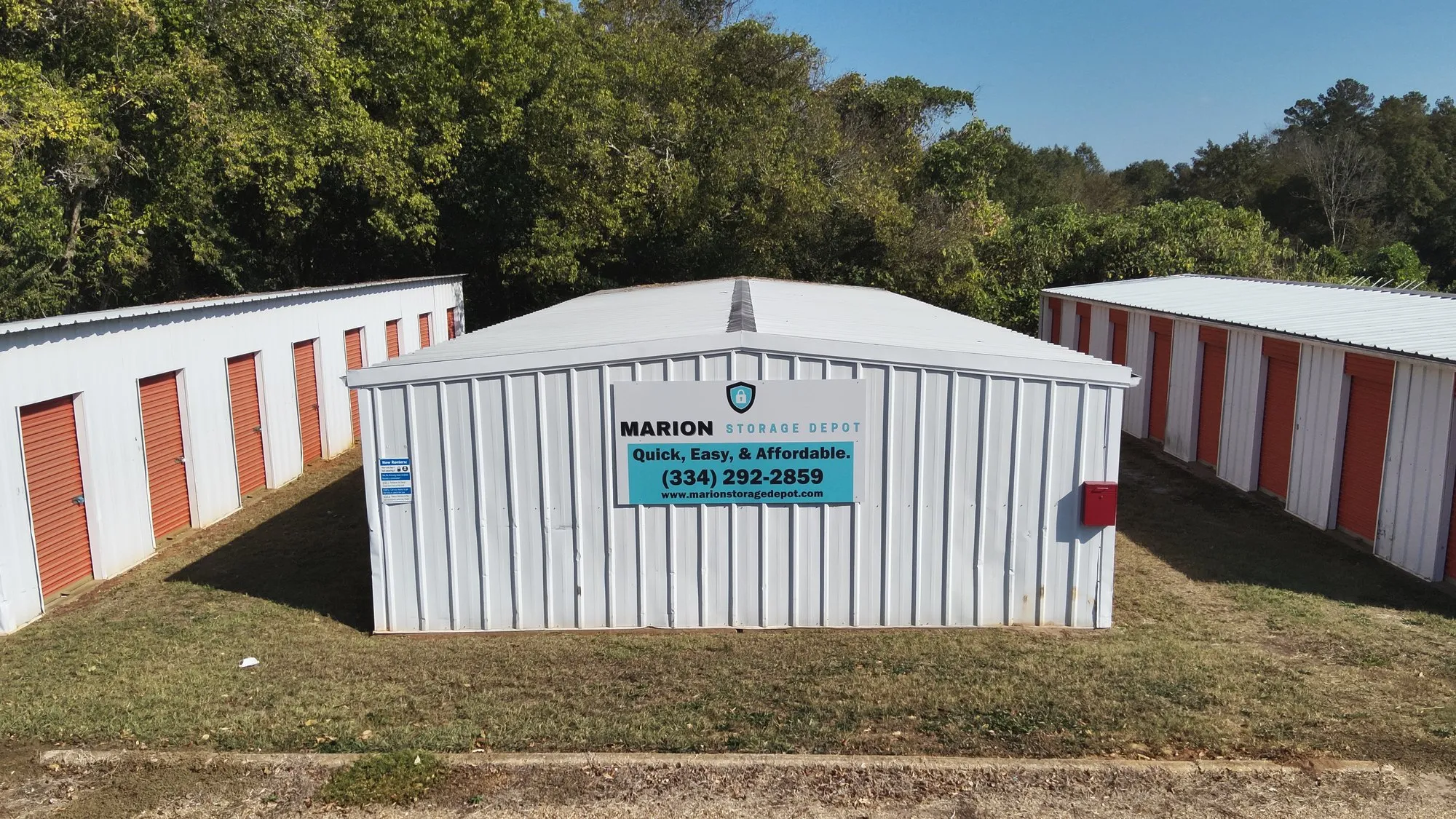Aerial view of the Pickens St facility showing the sign board and rows of storage units